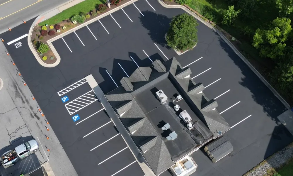 new-asphalt-sealcoating-parking-lot-aerial-view-clean-finishing